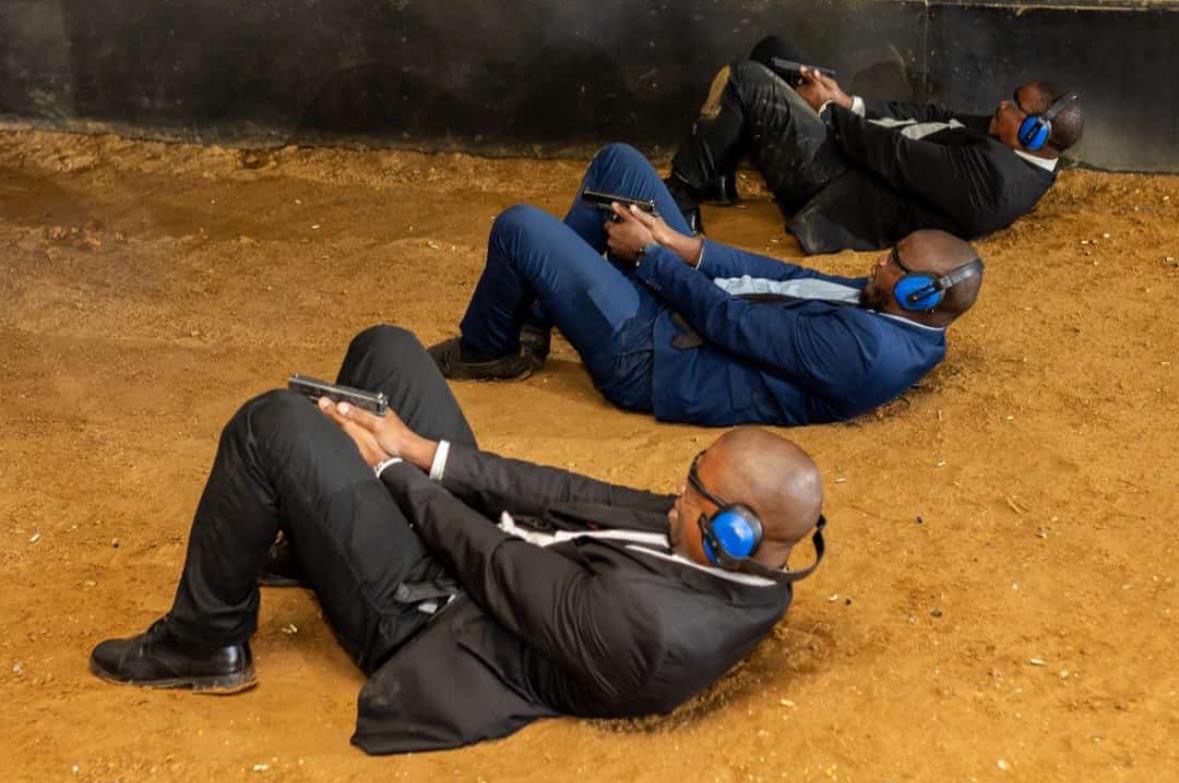 KM VIP Protection officers in prone firing position during live-fire firearms training